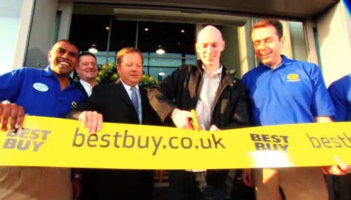 Best Buy men cutting ribbon